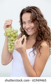 Closeup Of Woman Eating Grapes