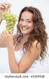 Closeup Of Woman Eating Grapes