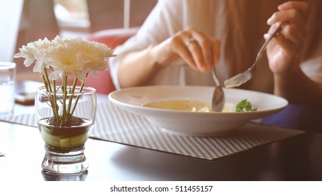 Close-up Of Woman Eating Pasta