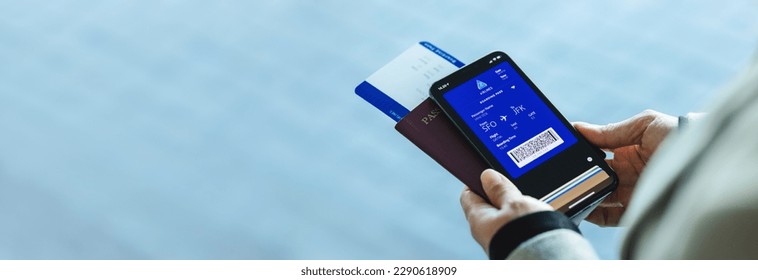 Closeup of a woman with electronic boarding pass on phone with passport and flight ticket at airport. Digital airplane ticket on the smartphone mobile app.