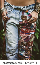 Closeup Of Woman In Embroidered Jeans In Boho Style