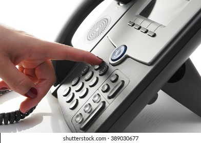 Closeup Of Woman Finger  Dialing A Telephone Number To Make A Phone Call