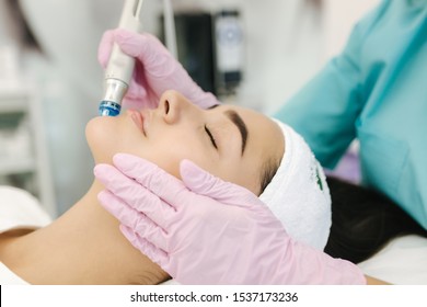 Close-up of woman getting facial hydro microdermabrasion peeling treatment. Female at cosmetic beauty spa slinic. Hydra vacuum cleaner. Cosmetology - Shutterstock ID 1537173236
