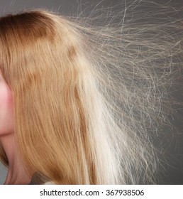 Closeup Of Woman Girl With Static Blonde Long Hair. 