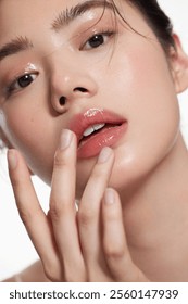 Close-Up of Woman with Glossy Lips and Radiant Skin - Natural Beauty and Minimalistic Makeup Concept.