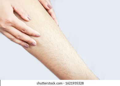 closeup woman with hairy, unshaven hair leg   - Shutterstock ID 1621935328