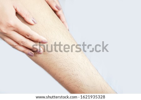 closeup woman with hairy, unshaven hair leg  
