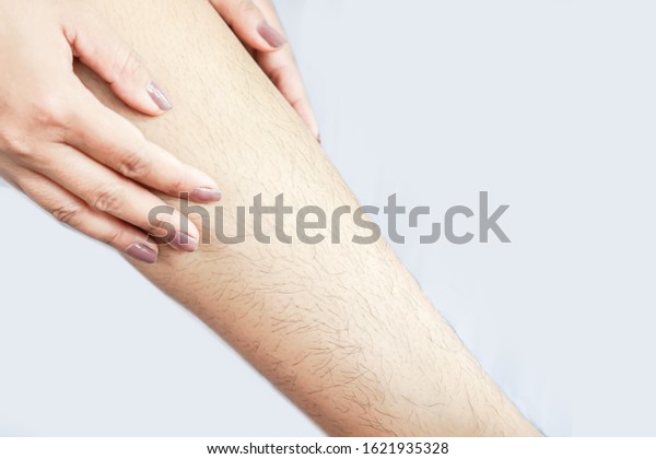 closeup woman with\
hairy, unshaven hair leg \
