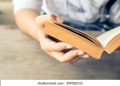 Closeup Woman Hand  Holding Pocket Book To Read