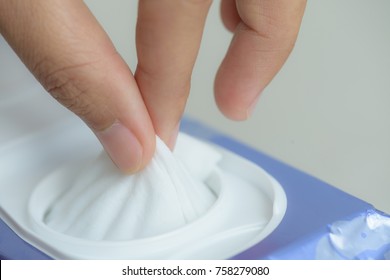 Closeup Woman Hand Holding Wet Wipes From Package.