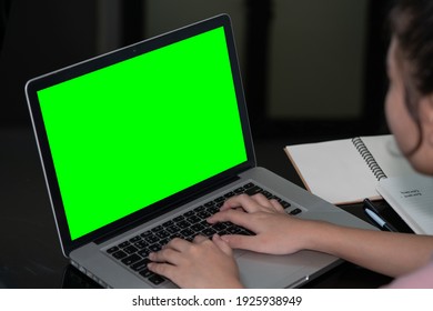 Closeup Woman Hand Using Computer Laptop. Using Online Connect Technology For Business, Education And Communication. Green Screen Computer For Graphic Display Montage.