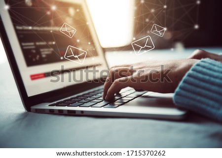 Closeup Woman hand using Laptop pc with email icon, Work from home, Email concept