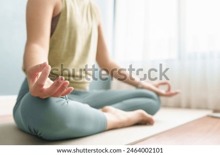 Closeup woman hand yoga lotus position at home. Breathing, Working out, Meditation, wellness concept