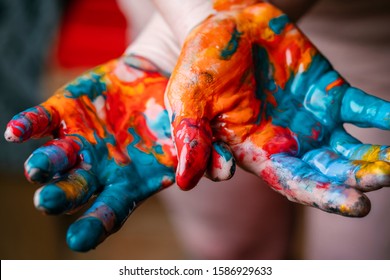 Closeup Of Woman Hands Dirty With Acrylic Paint. Creative Finger Painting.