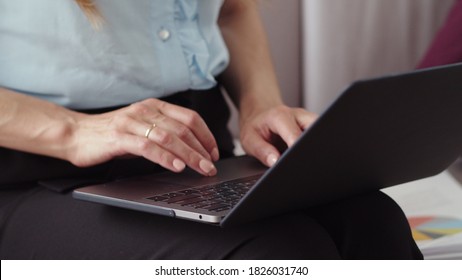 Closeup Woman Hands Typing On Laptop At Home Office In Slow Motion. . Unrecognizable Business Woman Writing Email On Laptop On Couch.