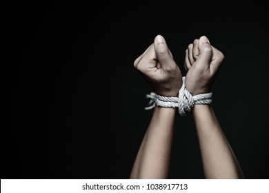 Closeup woman hands were tied with a rope. Violence, Terrified, Human Rights Day concept. - Shutterstock ID 1038917713