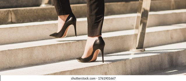 Closeup woman have pain in leg because wearing highheels. Concept about carrer and business