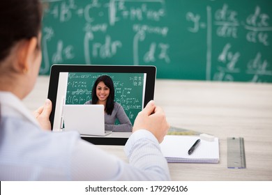 Close-up Of Woman Having Video Chat On Digital Tablet In Classroom - Powered by Shutterstock