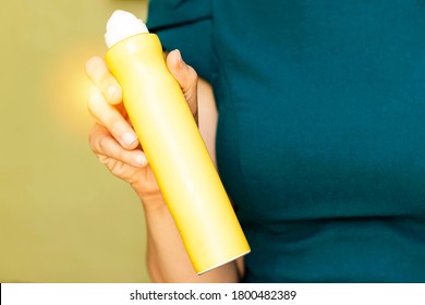 closeup woman holding Deodorant spray bottle  - Shutterstock ID 1800482389