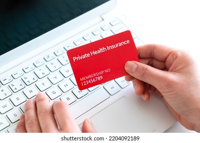 Close-up Of Woman Holding A Private Health Insurance Card With Laptop Concept