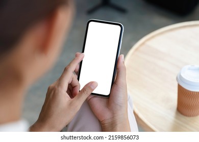close-up a woman holding and touch smartphone blank screen - Shutterstock ID 2159856073