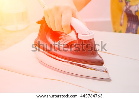 closeup, Woman ironing clothes on ironing board