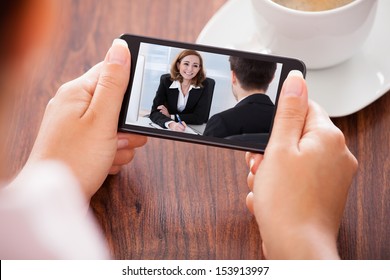 Close-up Of Woman Looking At Video Conference On Mobile Phone