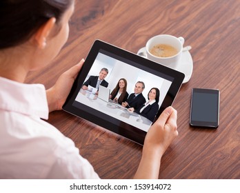 Close-up Of Woman Looking At Video Conference On Digital Tablet - Powered by Shutterstock