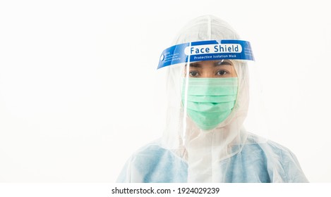 Closeup Woman Medical Staff Doctor In PPE Uniform Wearing A Face Mask Protective And Plastic Face Shield For Quarantine Coronavirus Outbreak (COVID-19) Isolated On White Background