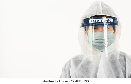 Closeup Woman Medical Staff Doctor In PPE Uniform Wearing A Face Mask Protective And Plastic Face Shield For Quarantine Coronavirus Outbreak (COVID-19) Isolated On White Background