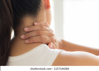 Closeup Woman Neck And Shoulder Pain And Injury. Health Care And Medical Concept.