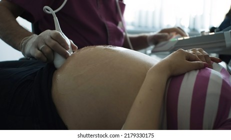 Closeup Of Woman On Pregnancy Ultrasound Scan At Maternity HospitalCloseup Of Woman On Pregnancy Ultrasound Scan At Maternity Hospital