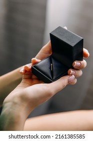 Closeup Of A Woman Opening A Jewelry Box With An Engagement Diamond Ring.