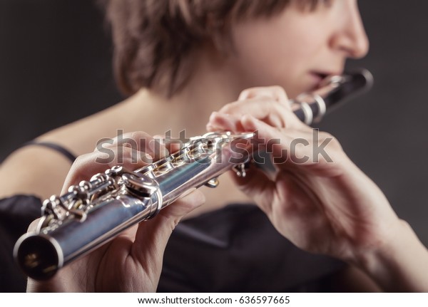 Closeup Woman Playing Flute On Black Stock Photo Edit Now 636597665