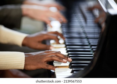 Close-up Of Woman Playing The Piano Together With Man In Duet During Their Performance