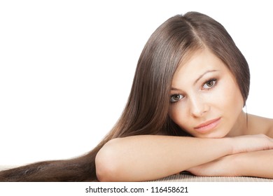 closeup woman portrait with long shiny laying hair on horizontal surface