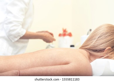 Closeup of woman receiving acupuncture treatment at beauty spa. Picture with copy space