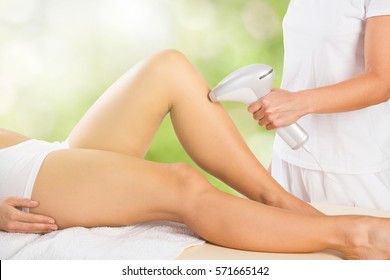 Close-up Of A Woman Receiving Laser Epilation Treatment On Customer Leg