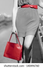 Closeup Of Woman With Red Shopping Bag And Belt Walking