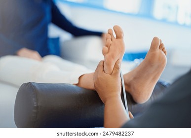 Closeup, woman and relax with therapist for foot massage, beauty treatment or pedicure at spa. Feet of female person with masseuse or beautician for skincare, pamper or physical therapy at salon - Powered by Shutterstock