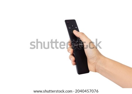 Close-up woman of right hand held, use finger press button on black remote control isolated on white background. Concept of technology, connection, communication, social.