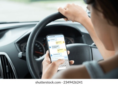 Close-up Of Woman Sitting Inside Car Typing Text Message On Mobile Phone - Powered by Shutterstock