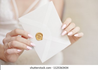 Close-up Woman With Slim Body Holding Invitation Envelope Card In Hands, Rear Veaw.