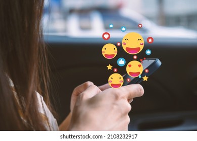 Close-up of a woman in a soft shirt using the smart phone, hands holding and typing to communicate with others through emoji and text online. - Powered by Shutterstock