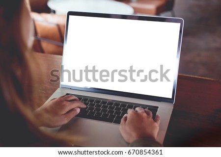 close-up woman typing laptop computer rear view