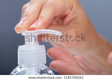 Close-up Of A Woman Using Rubbing Alcohol