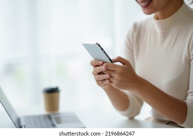 Close-up Of A Woman Using A Smartphone To Work On Various Application Including Mobile Transaction To Send Messages, LINE, And Various Business Information Sent Via Social Media.