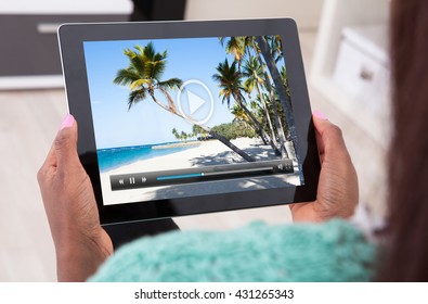 Close-up Of A Woman Watching Video On Digital Tablet - Powered by Shutterstock