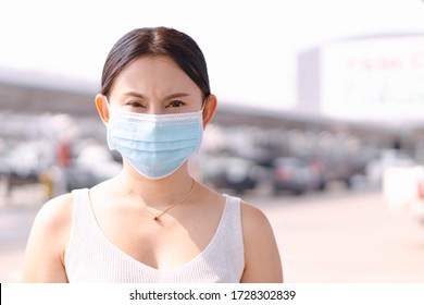 Closeup Woman Wearing Face Mask For Protect Air Polution Or Virus Covid 19 In Car Park Of Supper Market  Background, Health Care And Medical Concept