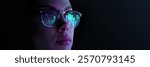 Close-up of woman wearing glasses reflecting digital bar charts and graphs, symbolizing data analysis, technology, and statistics. Concept of business, modern technologies, finance. Banner